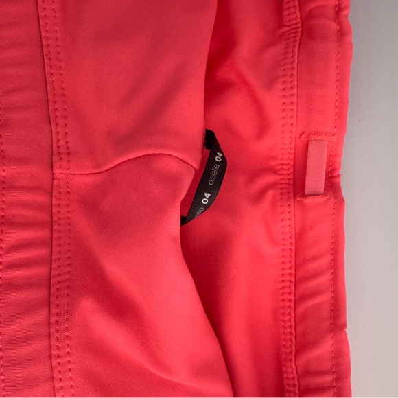 Oiselle Women's Roga Shorts in bright coral - Picture 5 of 5